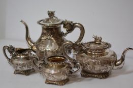 A striking Chinese Export silver four piece tea and coffee service, maker's mark for Chonghang