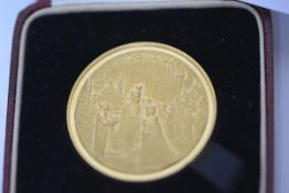 Pahlavi Dynasty, a gold commemorative medal, Coronation of 1967, stamped 900, conjoined busts of the