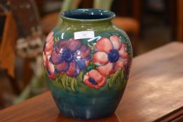 A large William Moorcroft Anemone pattern baluster vase, tubelined and painted against a shaded