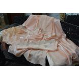 A group of 1930's/40's lingerie, part of a trousseau, comprising a variety of garments in peach