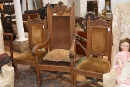 A carved oak armchair in 17th century style, late 19th century, with basket, scroll and swag-