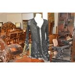 A vintage heavily beaded lady's evening jacket, decorated with clear and black bugle beads in