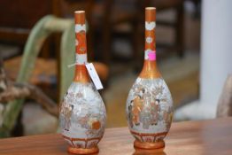 A pair of Kutani porcelain vases, Meiji period, each of slender bottle form with elongated neck,