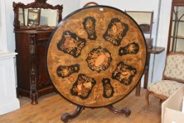 A striking marquetry inlaid walnut tilt-top breakfast table, mid-19th century, the circular top