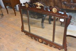 A George III style parcel gilt mahogany tripartite fretwork mirror, c. 1900, the crest applied