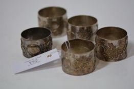 A set of four Chinese Export napkin rings, each decorated in relief with flowering boughs, marked CS