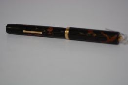 A Dunhill Namiki lever-fill fountain pen, c. 1930, with black lacquer decoration of a pheasant and