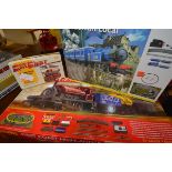 Two Hornby boxed model rail sets: Caledonian Local, 00 gauge; and West Coast Highlander, 00 gauge;