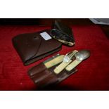 An officer's leather cased travelling spoon, knife and fork field set, the folding implements