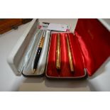 A vintage Parker 1/10 12ct rolled gold two pen set, cased; together with a Parker 1/10 12ct rolled