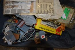 A collection of N gauge and 00 gauge plastic model rail, some boxed together with station