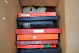 A box containing nine albums of GB and World stamps