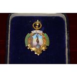 A 9ct gold and enamel Rugby Union medal, decorated with an image of the Border Reiver statue, the