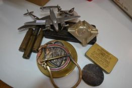 A group of World War II model aeroplanes, souvenir shells, tins and ashtrays