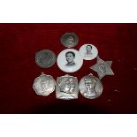 A small group of Chinese Communist white metal medallions and two badges including one inscribed "To
