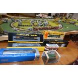 A small group of Graham Farish and other N gauge boxed locomotives together with a track board