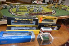 A small group of Graham Farish and other N gauge boxed locomotives together with a track board