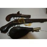 Two 18th/19th century pistols (incomplete) together with a leather powder pouch