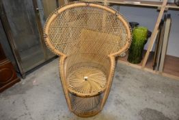 A rattan peacock back chair