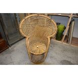 A rattan peacock back chair