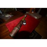 A brass four draw telescope, Broadhurst Clarkson & Co,, 63 Farringdon Road, London E.C., in a