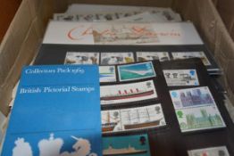 A box of GB First Day Covers and some presentation packs