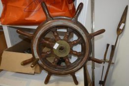 A brass-mounted ship's wheel