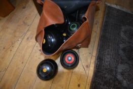 A group of eleven vintage lawn bowls in two bags