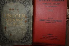 A box with early Lincoln stock album and mixed stamp books