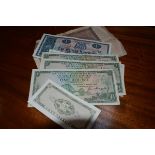 A mixed group of banknotes including four National Commercial Bank of Scotland £1 notes (1961-63)