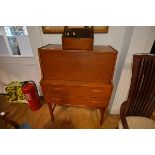 A vintage teak bureau with fall front over two long drawers