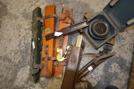 A group of vintage surveyor's equipment and instruments