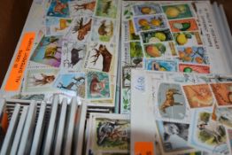 A box of thematic stamp packs