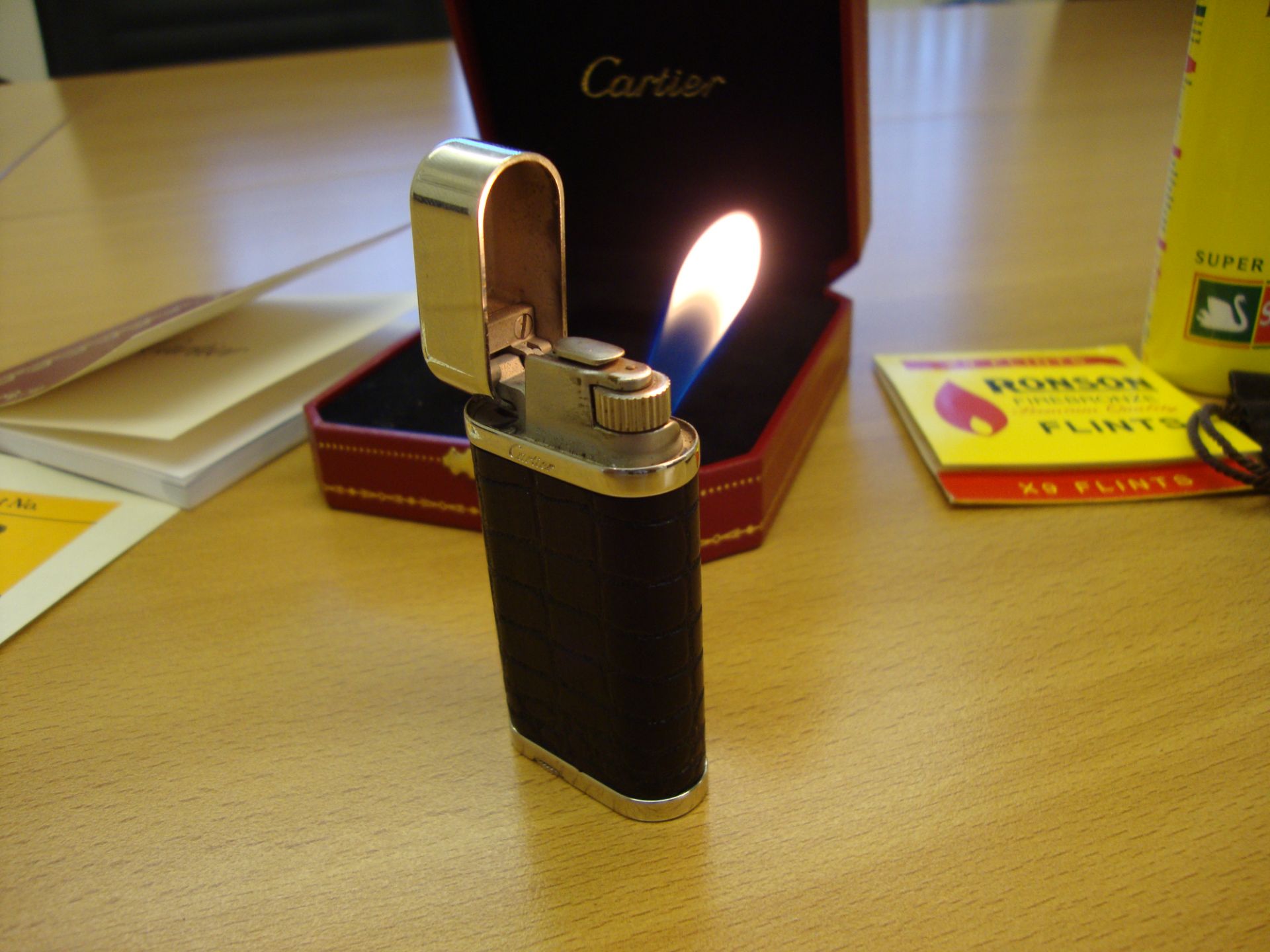 Cartier Lighter, in dark brown carved alligator skin style wood, with silver detailing. Serial