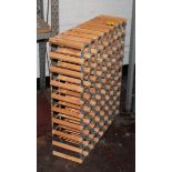 Wine bottle rack in pine and metal with capacity of 8 holes by 9 holes plus one additional row of