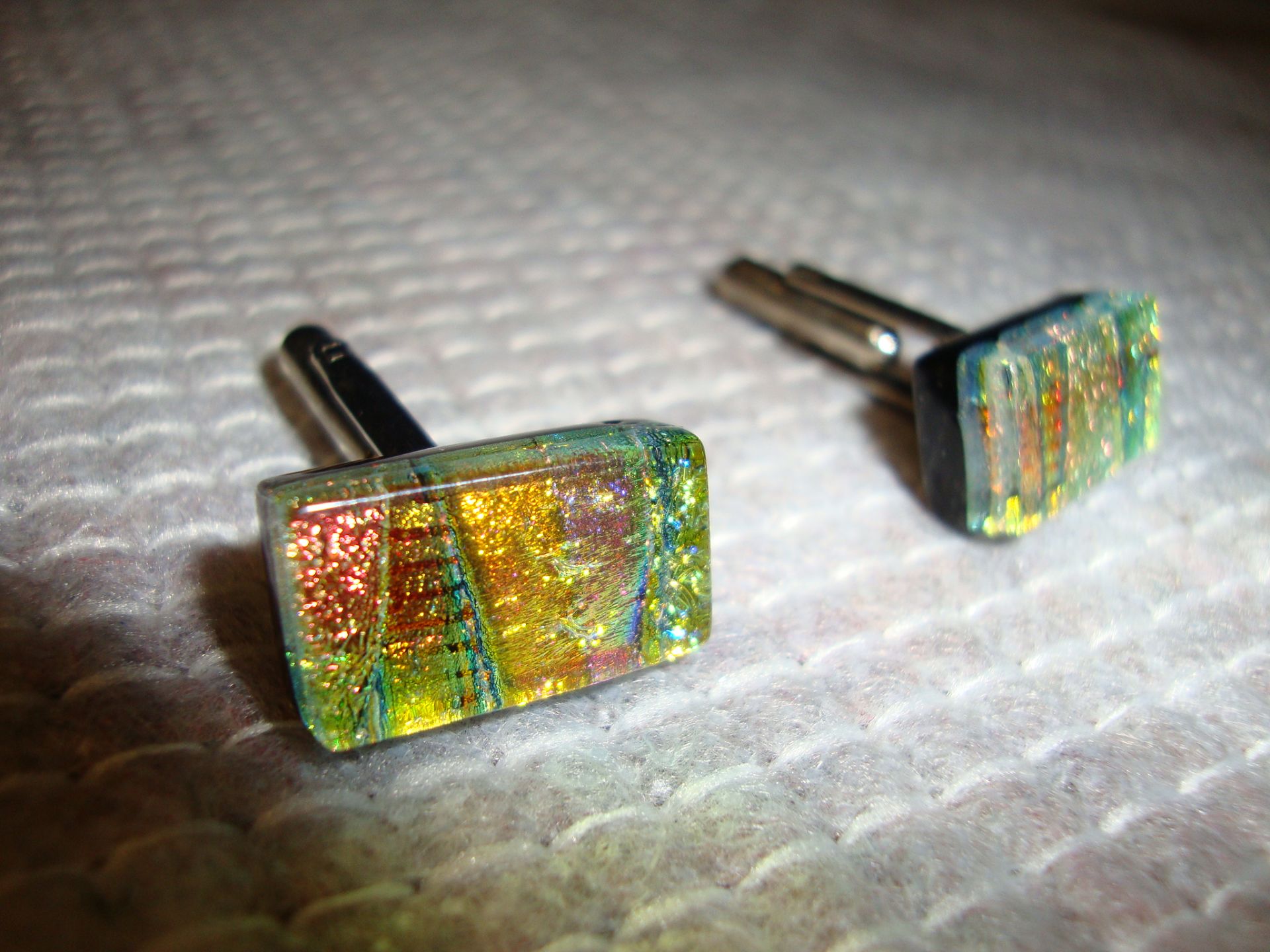 Pair of cufflinks understood to be handmade in glass