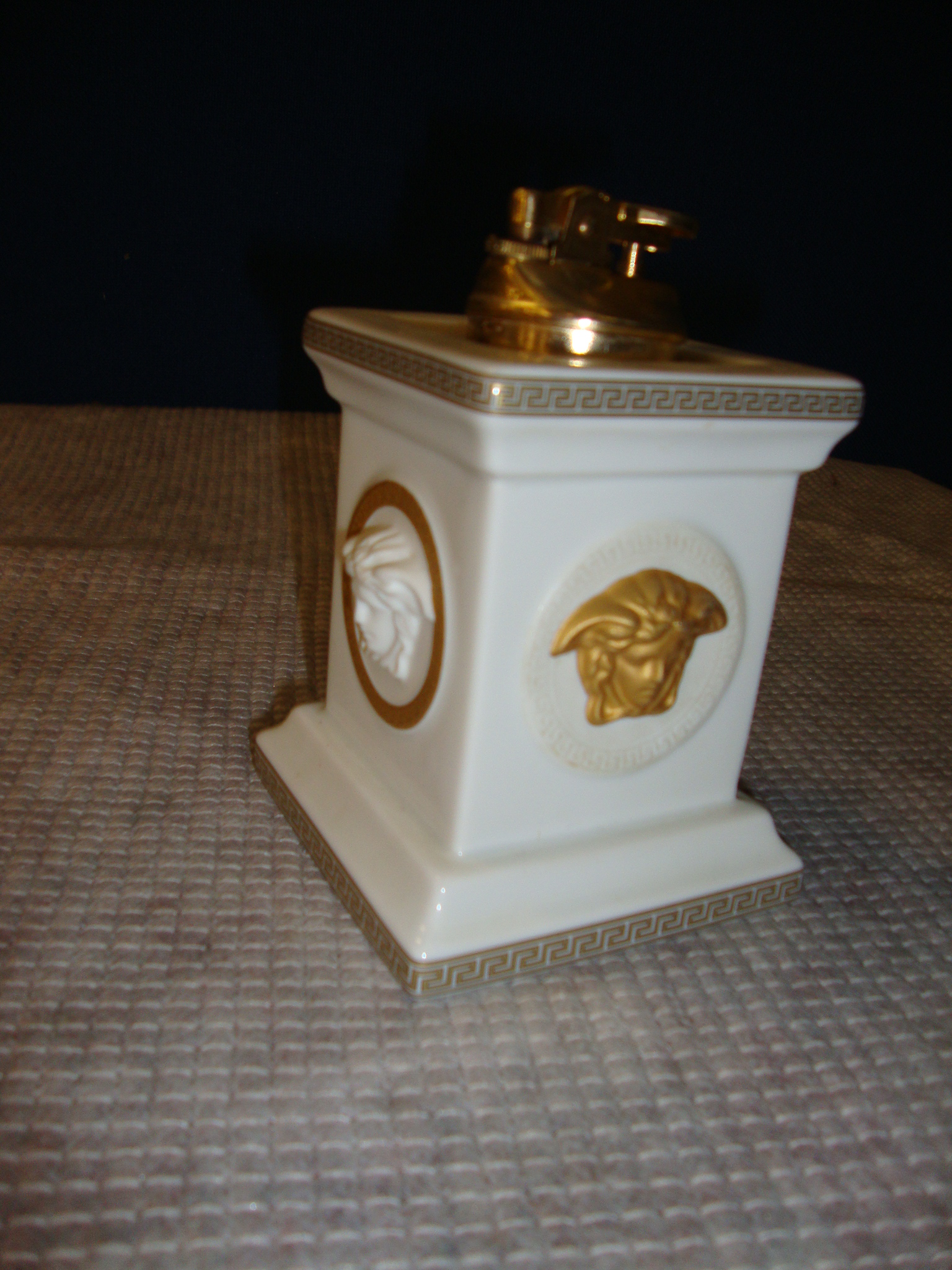 Versace by Rosenthal Gorgona table lighter, in white with gold detailing, with a removable lighter