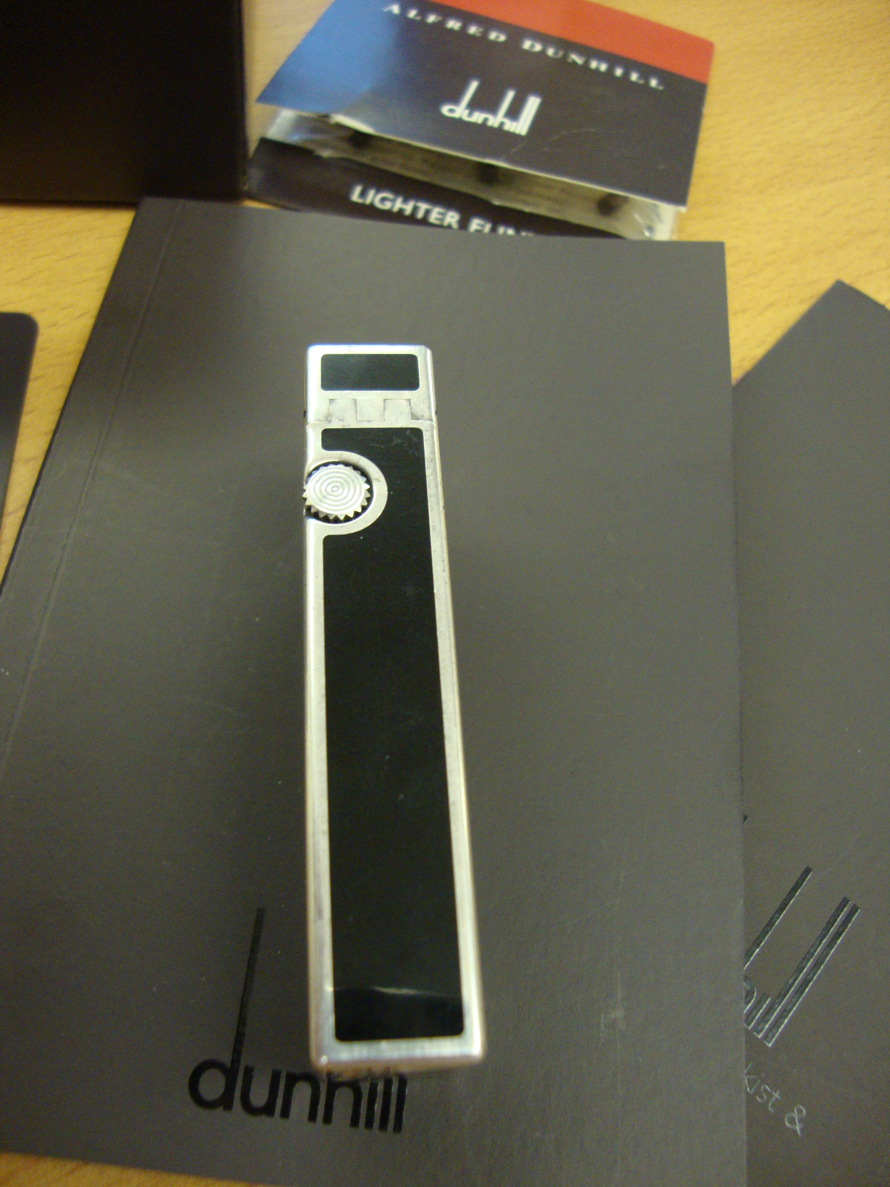 Dunhill rollagas lighter, model RL2301, in black laquer and silver, including box, book packs & - Image 8 of 12