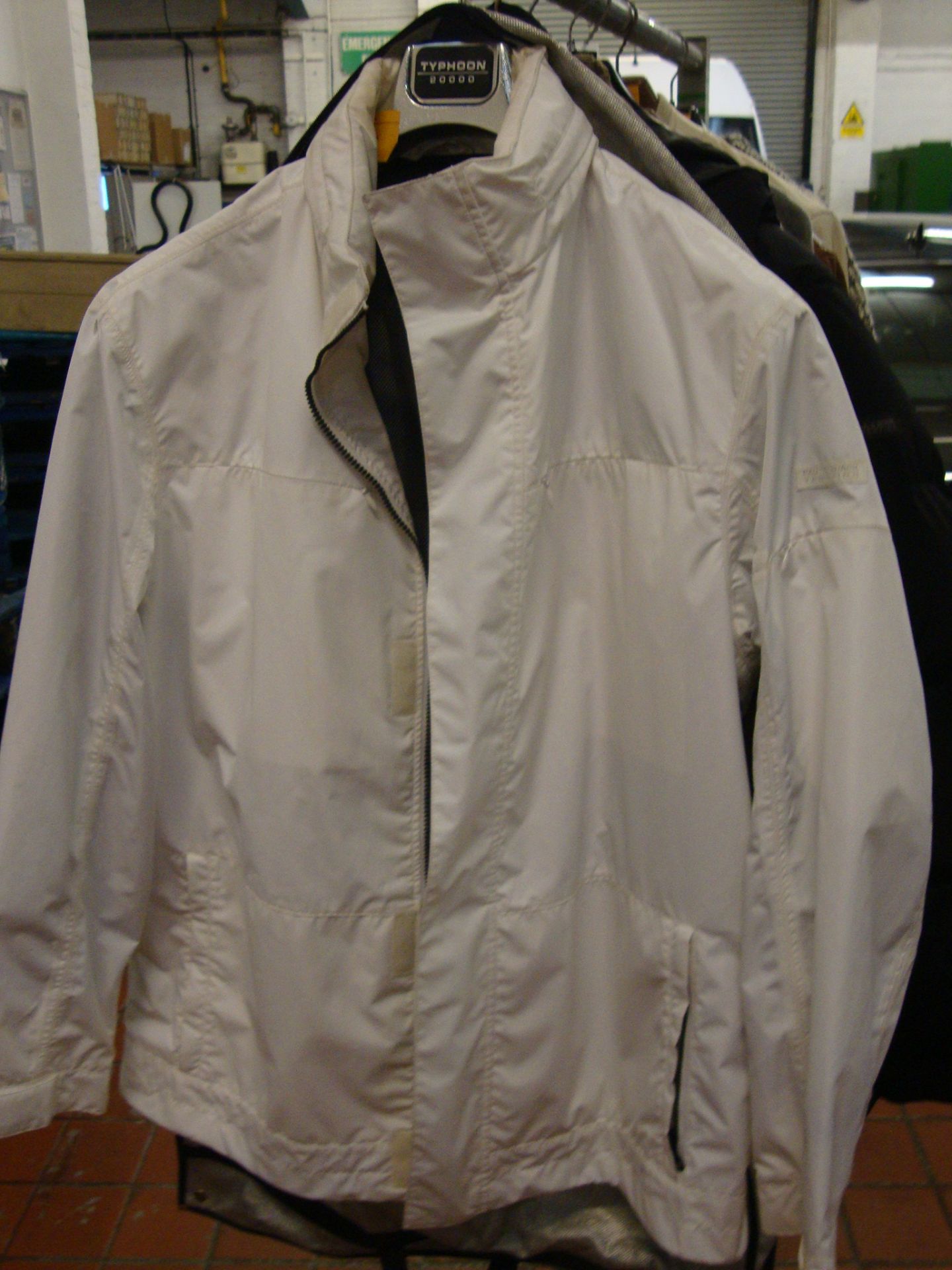 Paul & Shark Typhoon 2000 white storm jacket with mesh lining and multiple pockets. Hood zips into