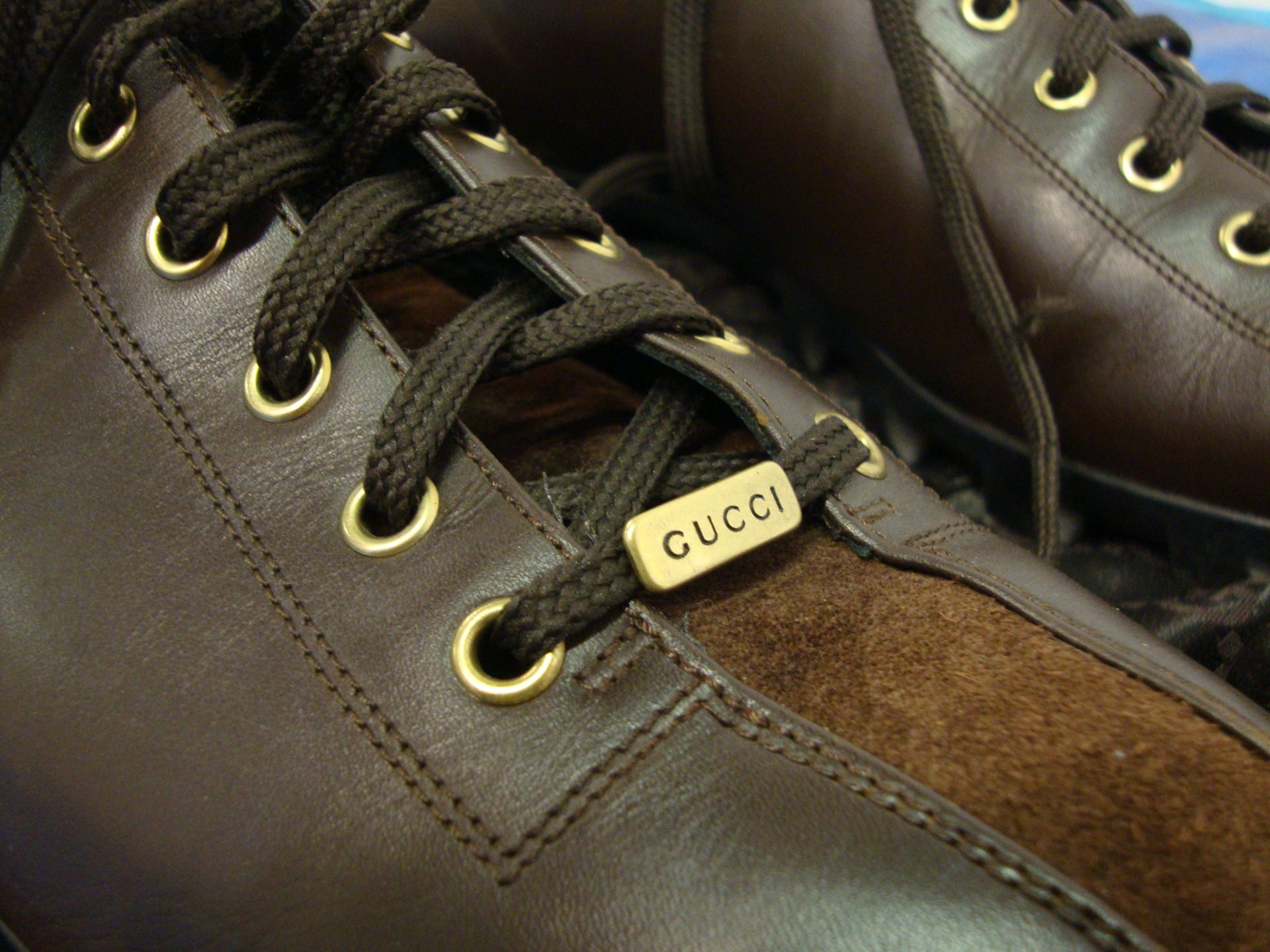 Pair of Gucci dark brown men's leather trainers size 46, with brown suede and gold trim, including - Image 3 of 4