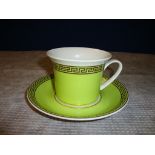 Versace by Rosenthal green and gold teacup and saucer, with primarily gold design Medusa head in the