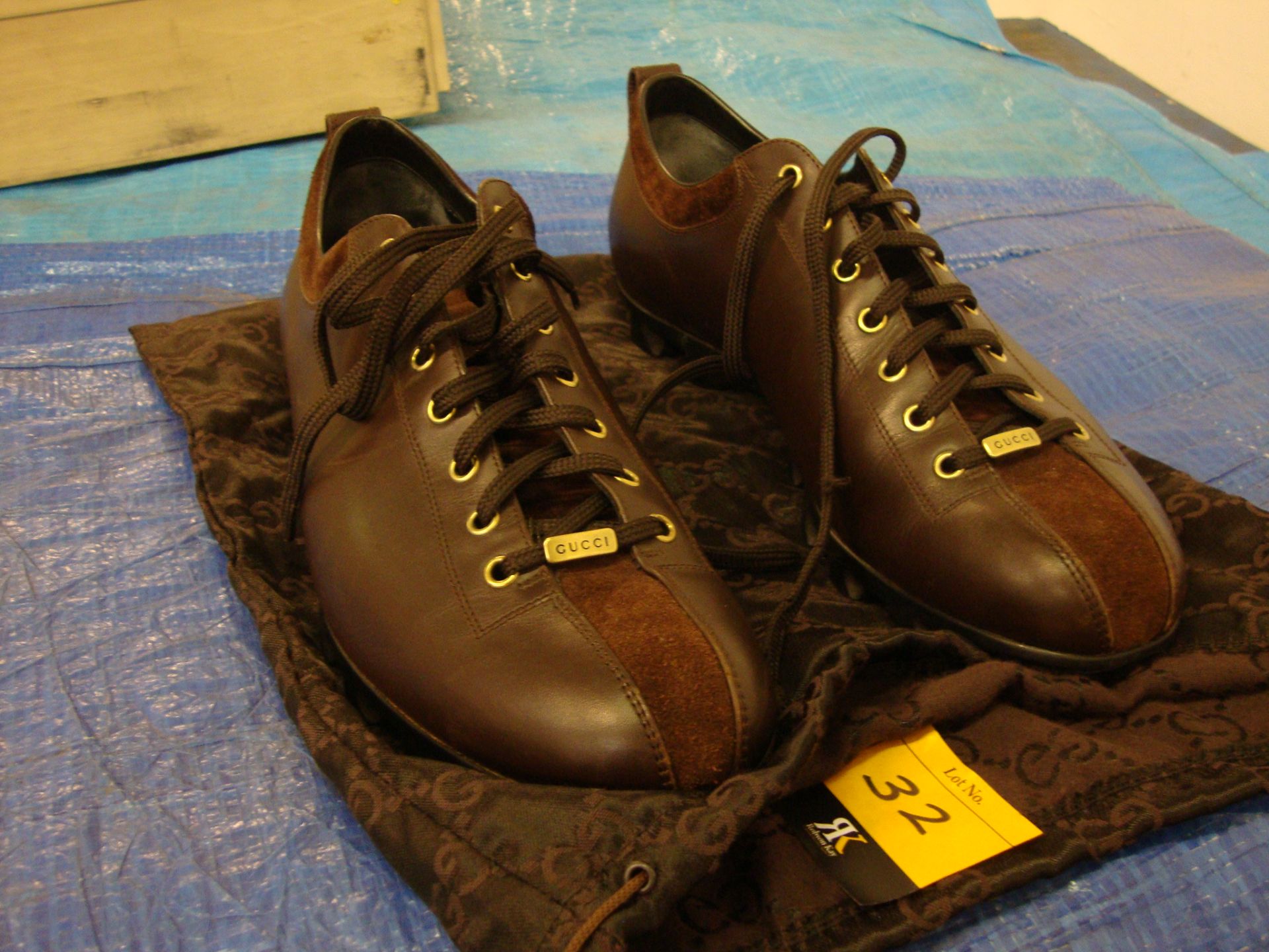 Pair of Gucci dark brown men's leather trainers size 46, with brown suede and gold trim, including