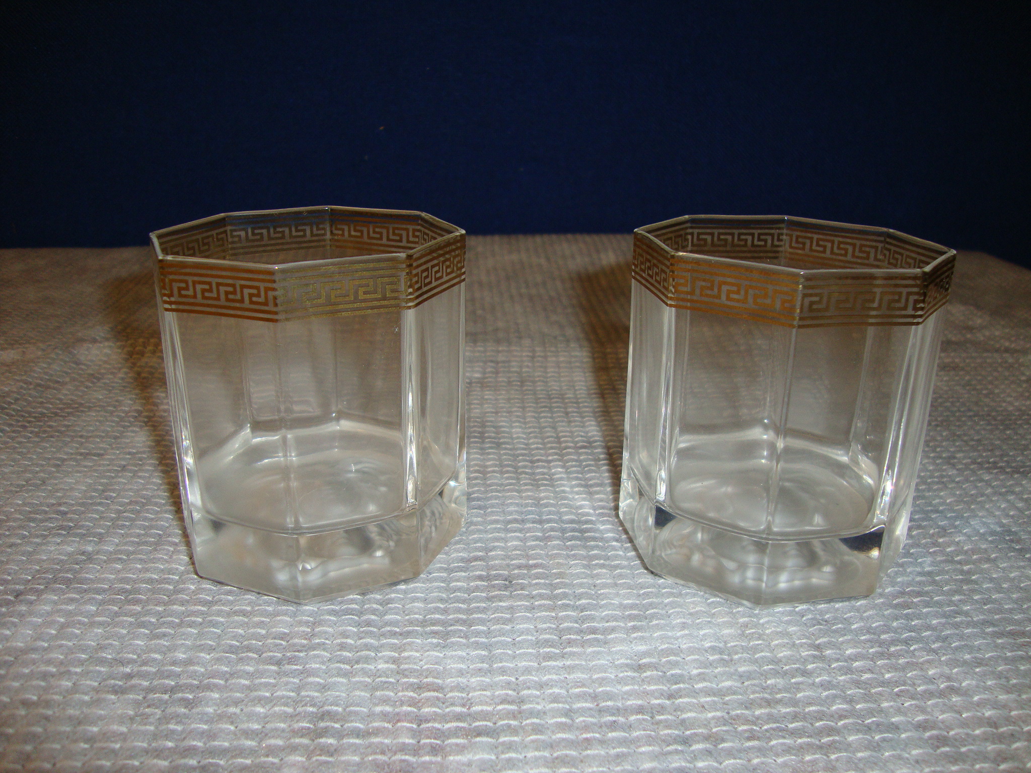 Pair of Rosenthal GB2 Versace Medusa d'Or tumblers, each 90mm tall, with a current retail selling