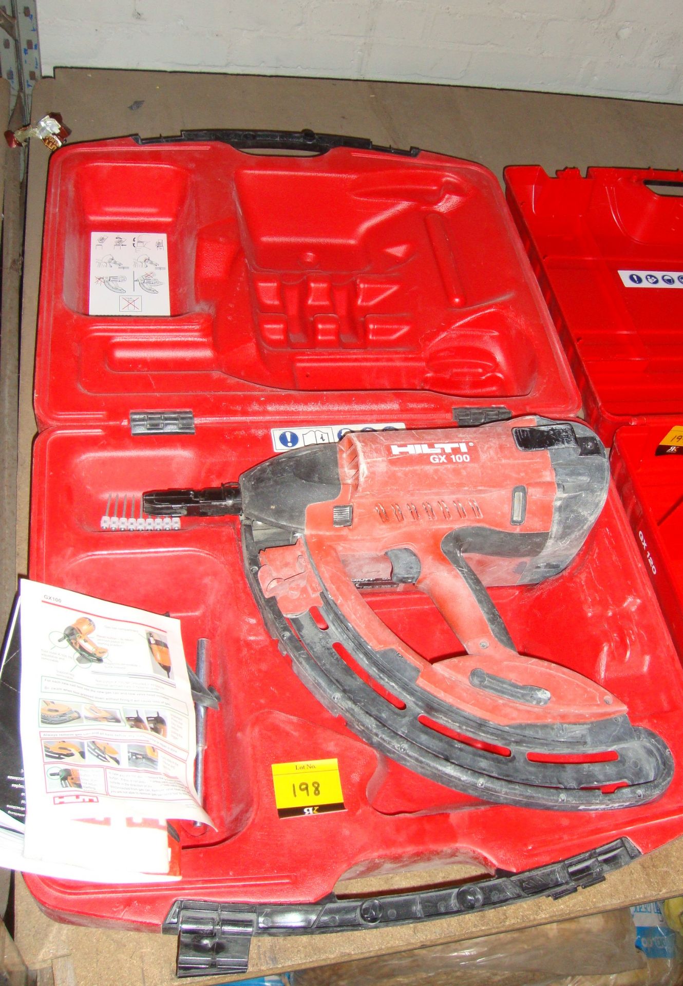 Hilti GX100 nail gun, including case, book pack and other minor ancillary items as pictured