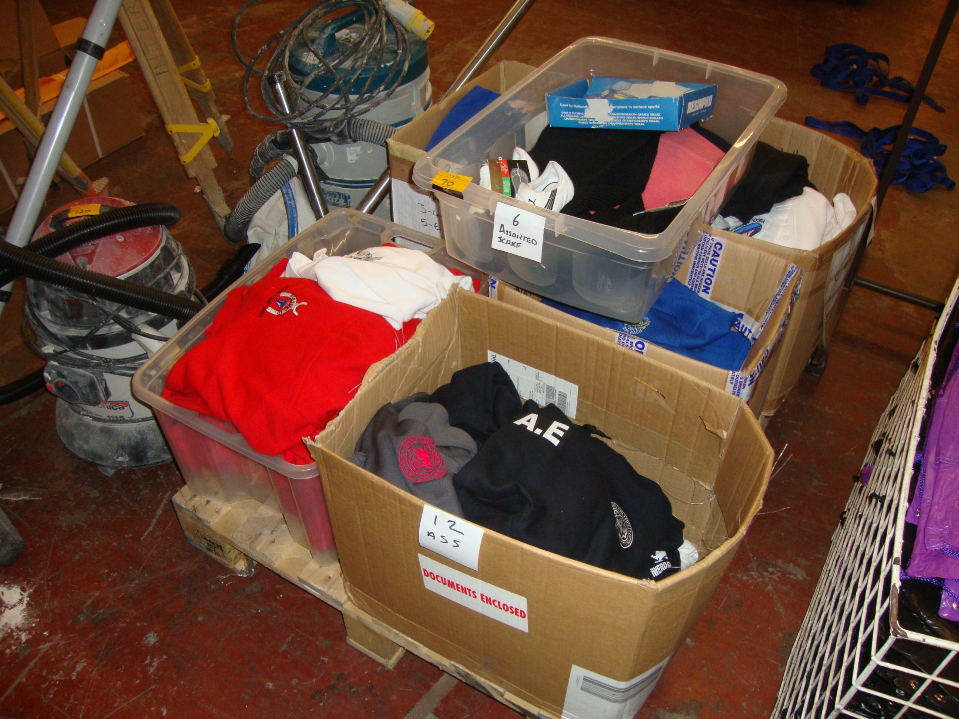 Contents of a pallet of assorted school uniform items, plus a quantity of scarves, Slazenger anti-