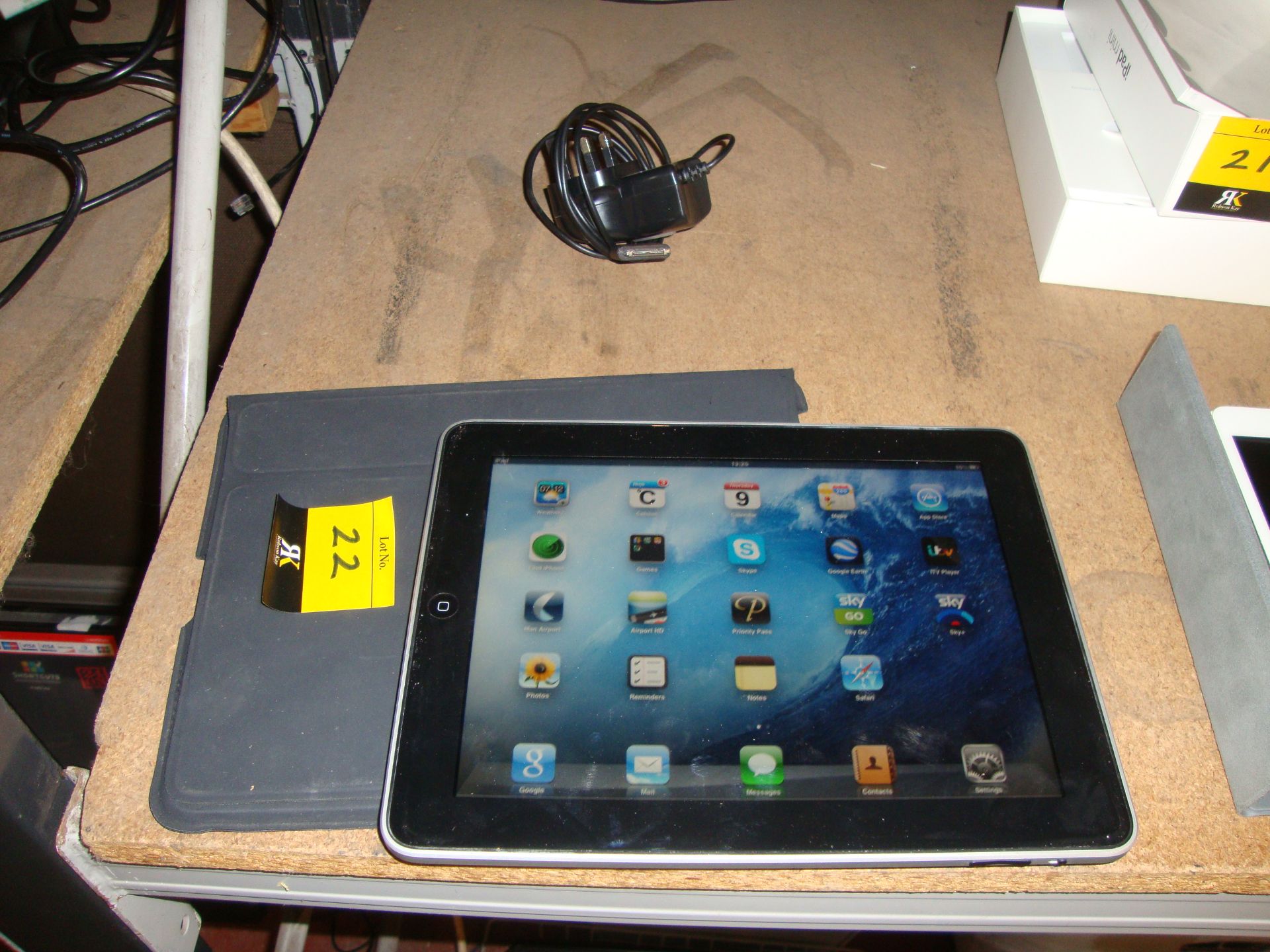 Apple iPad 32Gb model A1219, with silver back. Includes Smart Cover. Includes non-Apple branded