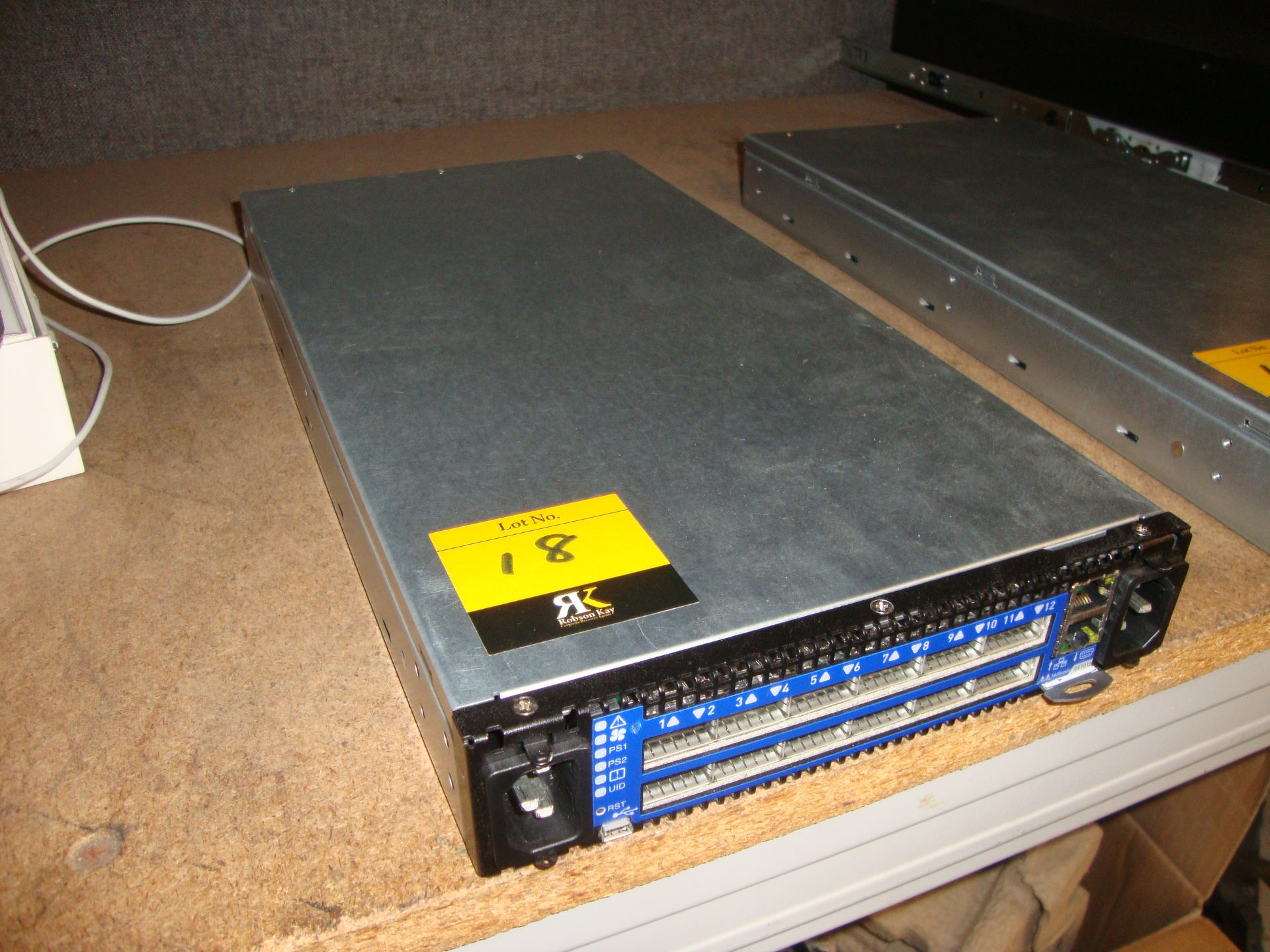 Mellanox model SX1012 switch with dual PSUs and 12xQSFP 40/56Gb ports, serial no. MT1519X01827. This