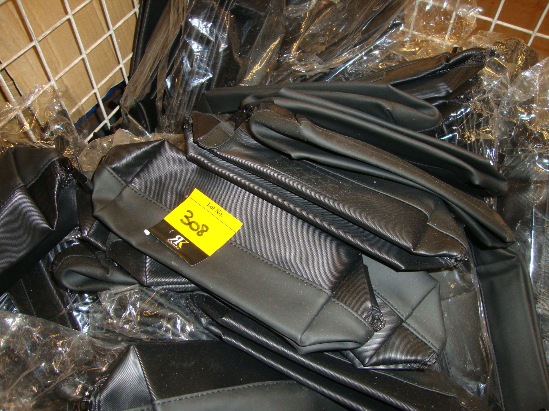 The contents of a cage containing a very large quantity of black zip up cosmetic pouches/toiletry - Bild 3 aus 3