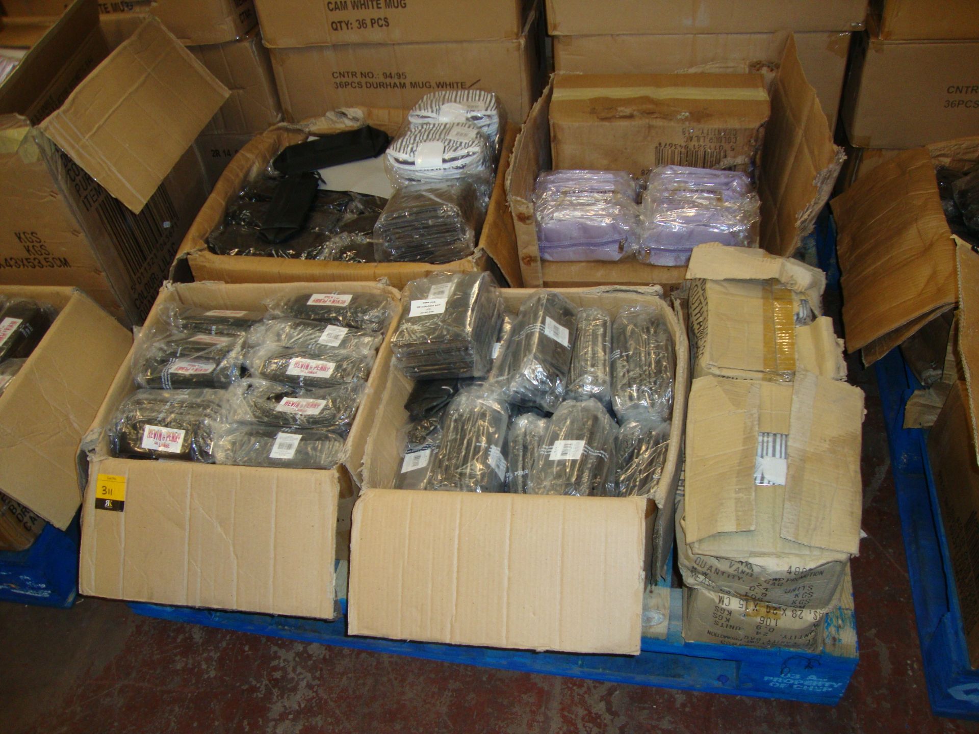 The contents of a pallet of assorted cosmetic/toiletry cases in a variety of colour schemes/styles