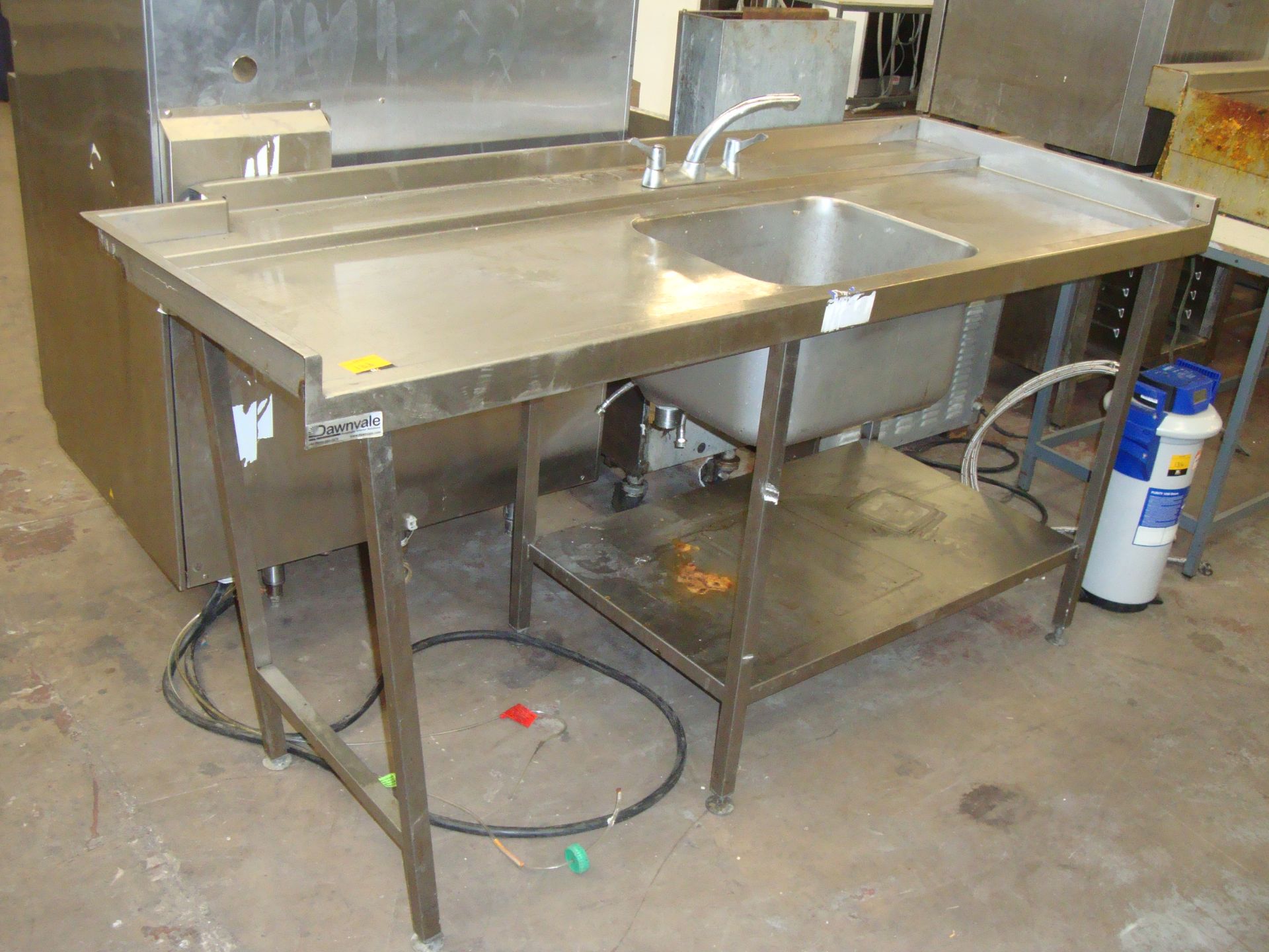 Large stainless steel floorstanding single bowl sink with mixer taps
